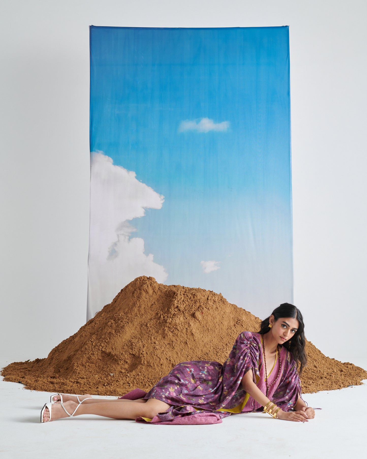 Fashion model styling Naarangi Falsa Fantasy kaftaan in purple, modern chic kaftaan outfit.