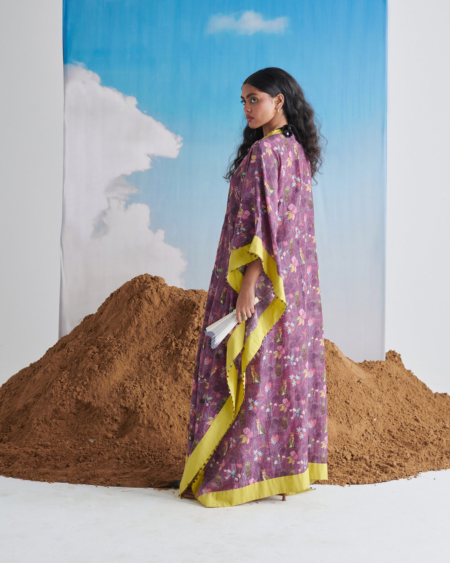 Three-quarter back angle of Plum Passion kaftaan; flowing silhouette with lime edging.
