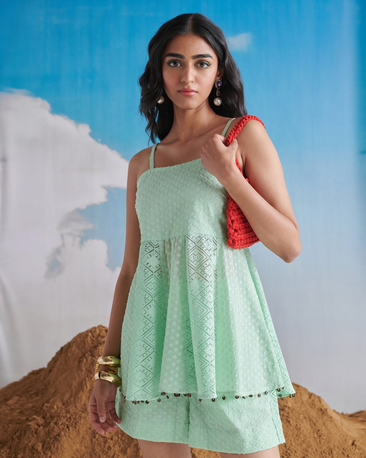 Naarangi Pudina Pop Short Set in mint green, side-front view featuring sleeveless top, lace details and layered shorts.