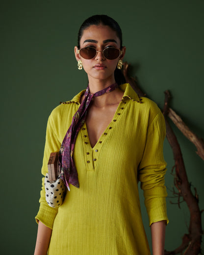 Close-up of model in Aam Panna mango yellow midi dress by Naarangi, styled with scarf, sunglasses and statement earrings.