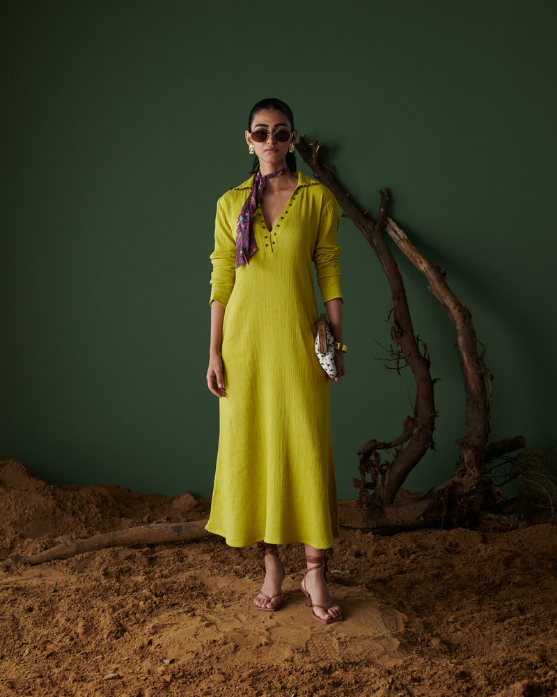 Model wearing Aam Panna mango yellow midi dress by Naarangi, styled with scarf, sunglasses, and statement earrings.