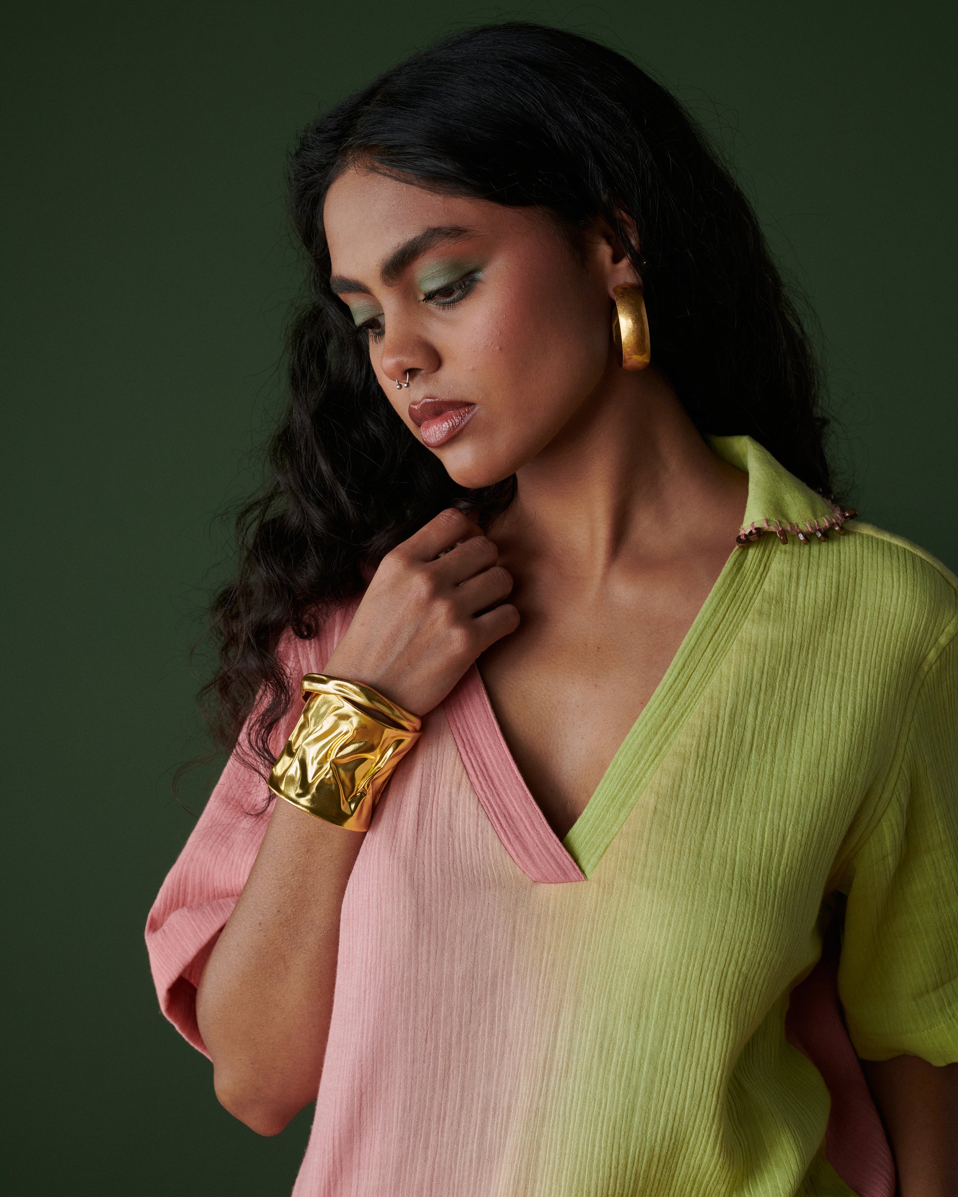 Close-up of Barfi Bloom Co-ord Set in pink and green, showcasing soft hand-dyed fabric, v-neckline and button detailing.