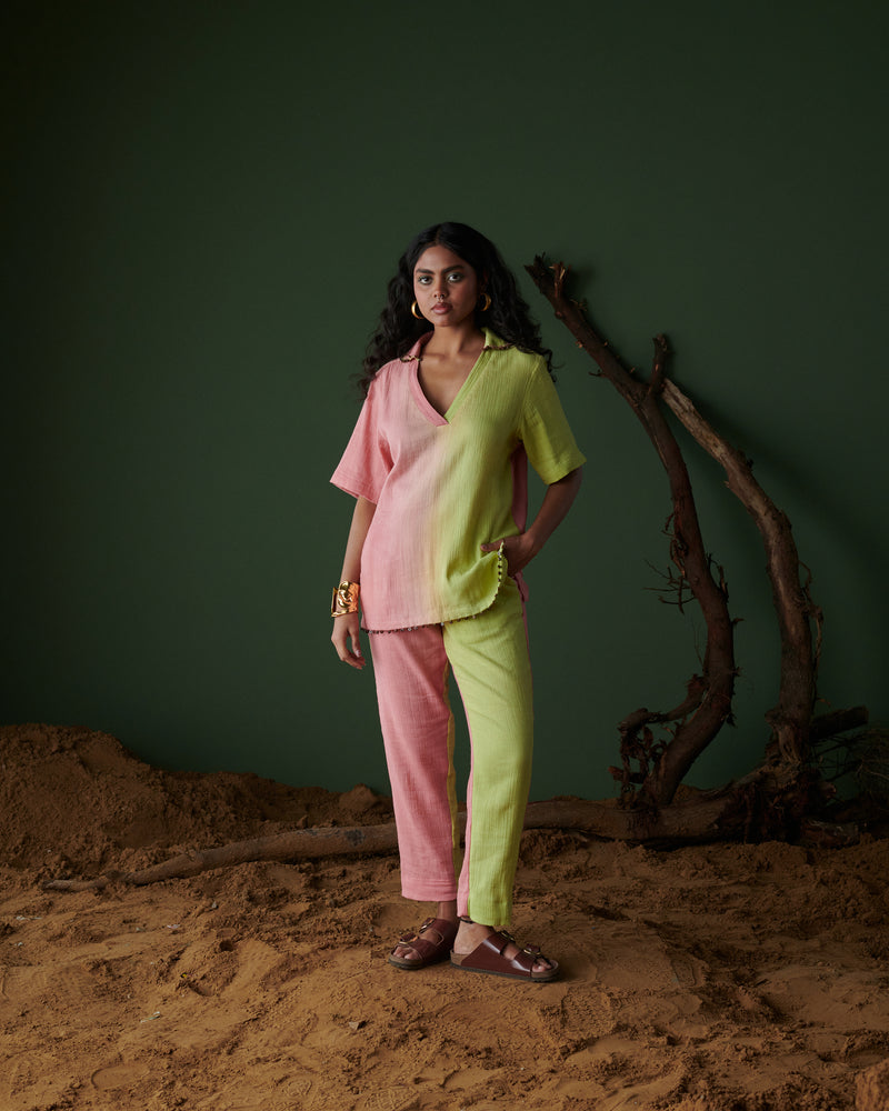 Model wearing Barfi Bloom Co-ord Set in hand-dyed soft pink and green with relaxed fit, chic button accents and v-neckline.