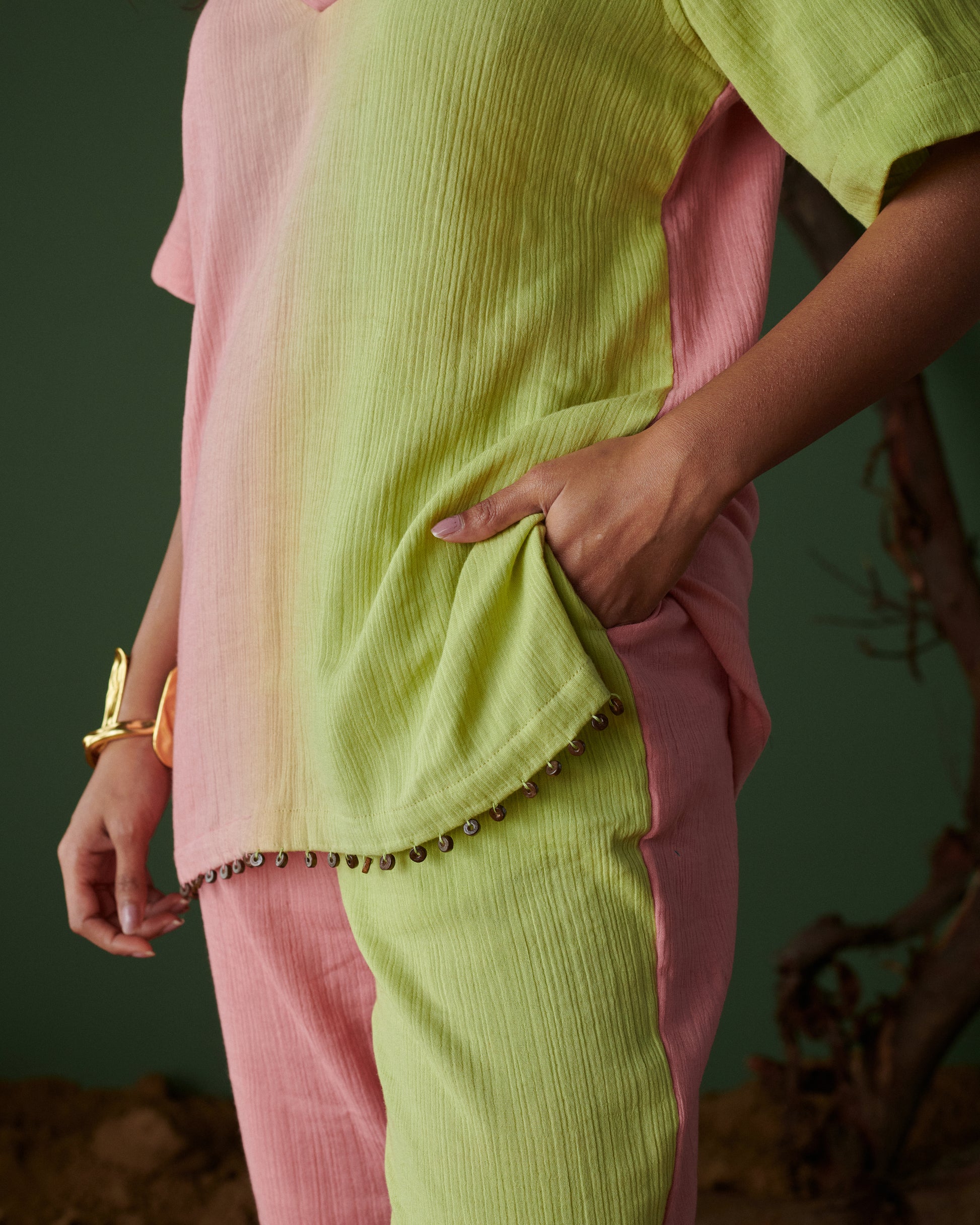 Barfi Bloom Co-ord Set pocket detail in hand-dyed pink and green fabric with delicate bead edging and soft texture.
