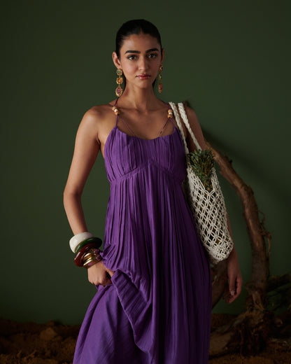 Jamun Jalsa purple maxi dress with pleated detail, bead straps and flowy silhouette styled with chic tote by Naarangi.