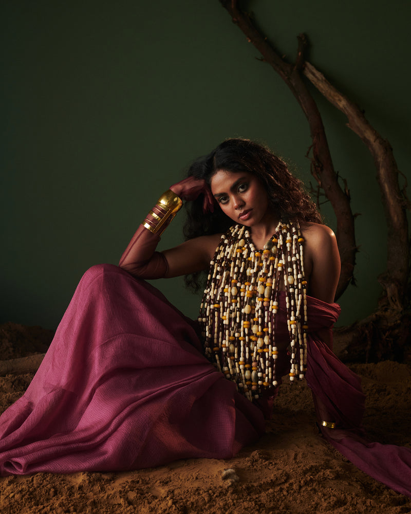 Kokum Crush plum handwoven saree with blouse by Naarangi, detailed with aari border and styled for festive fashion.