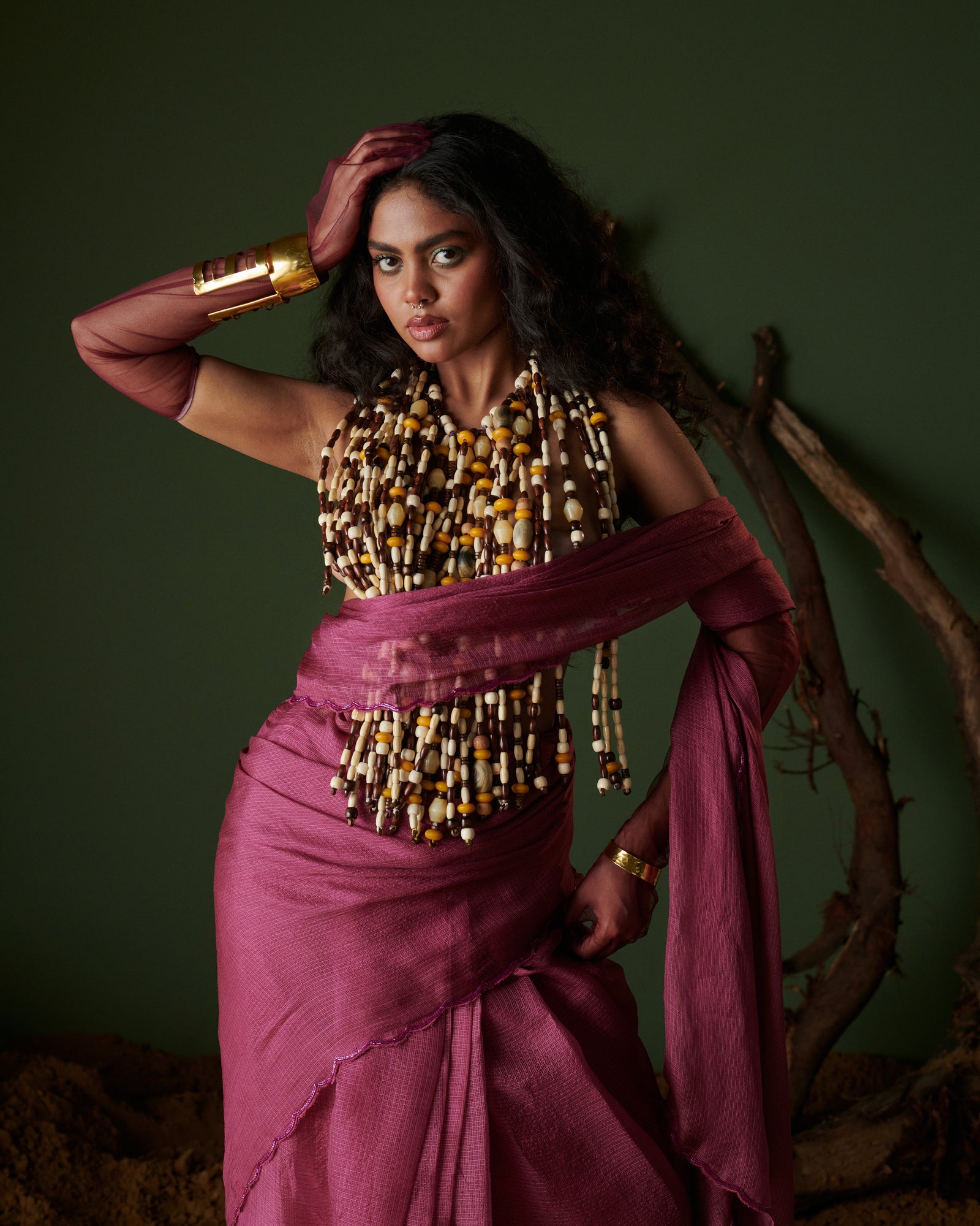 Close-up of Kokum Crush plum saree with blouse by Naarangi, airy fabric with aari border styled for festive fashion.