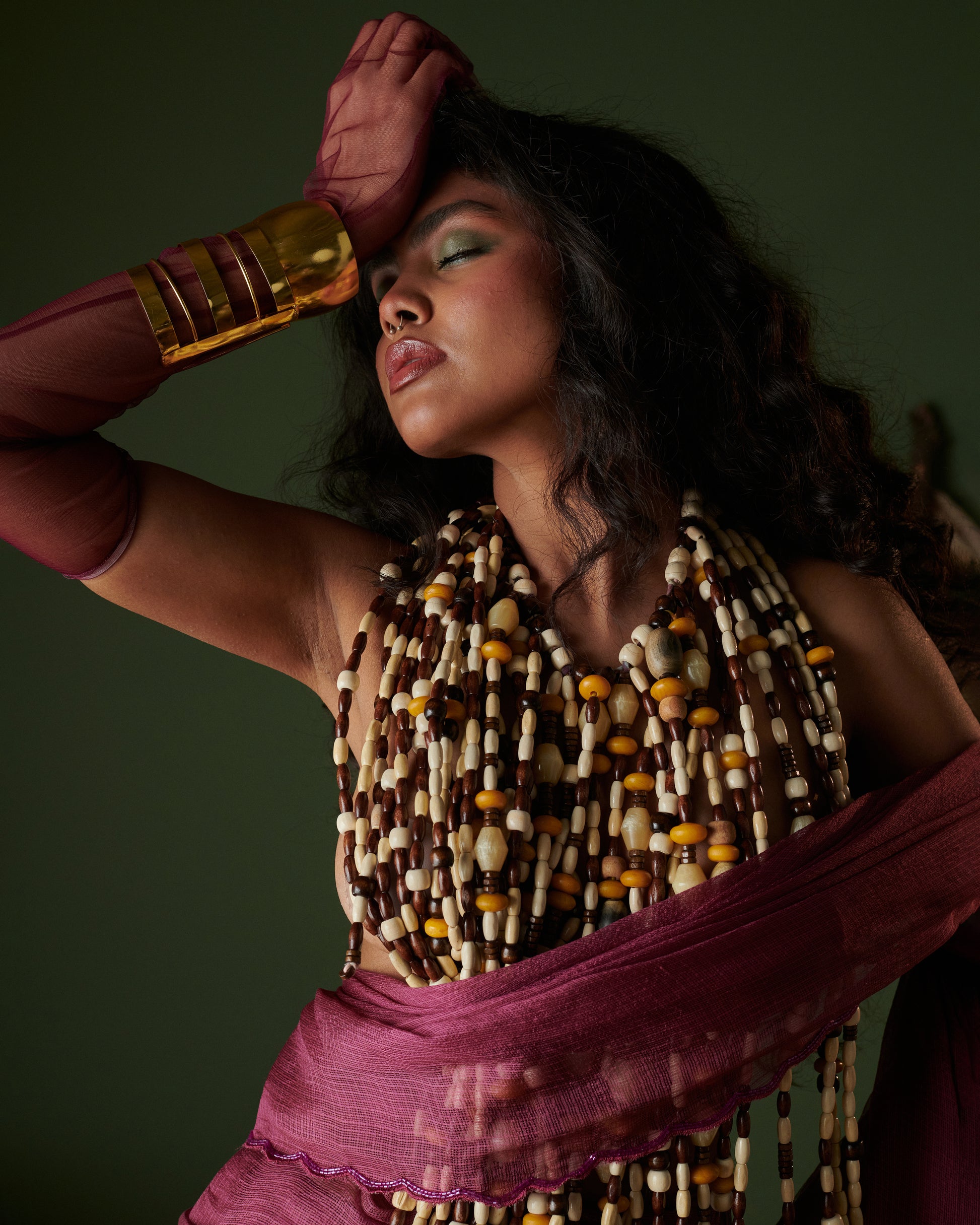 Dramatic close-up of Kokum Crush plum saree with blouse by Naarangi, aari border drape styled with festive jewelry.