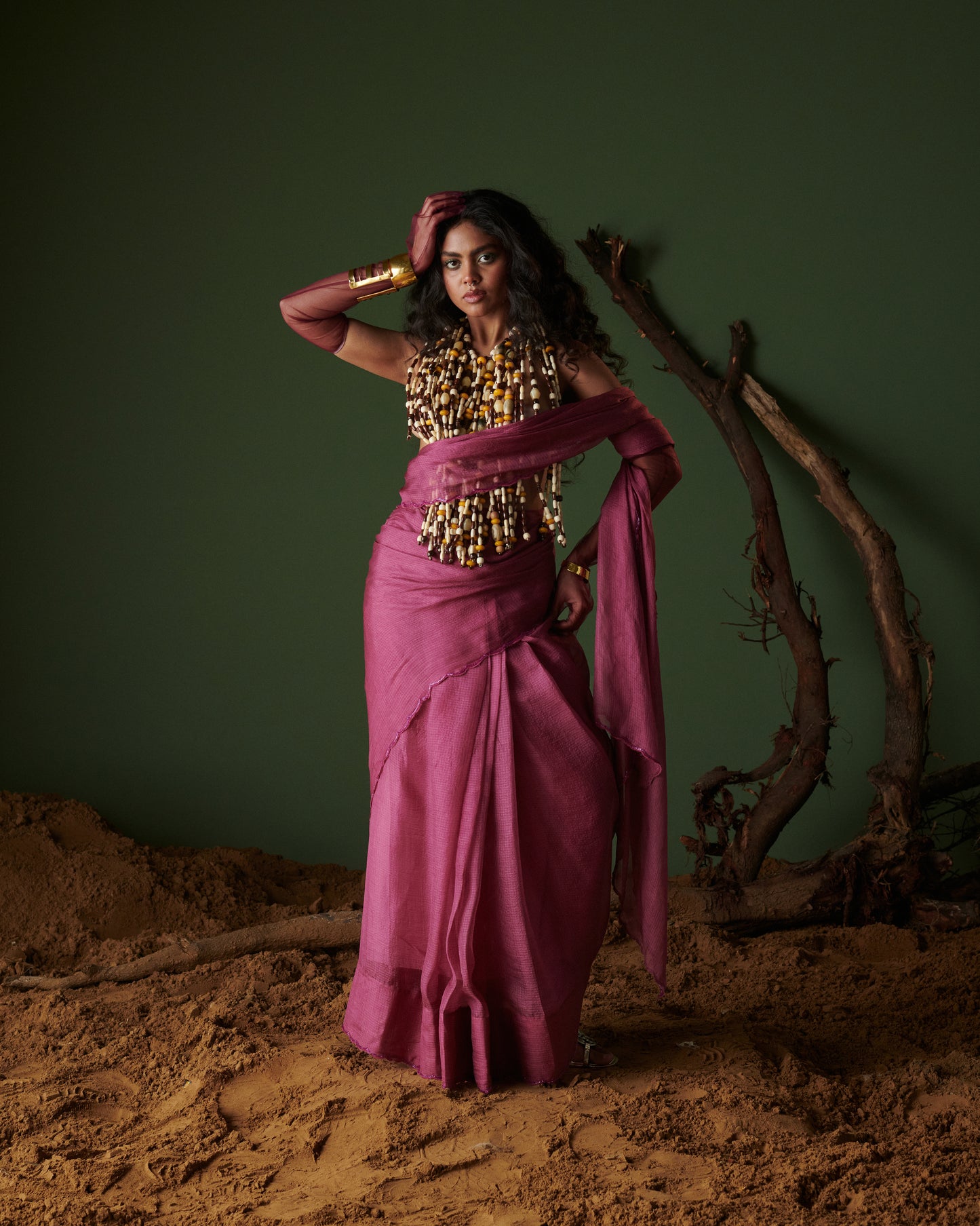 Full body look of Kokum Crush plum saree with blouse by Naarangi, handwoven airy drape styled with festive jewelry.