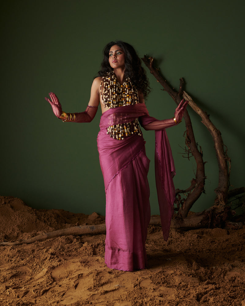 Model in Kokum Crush plum saree with blouse by Naarangi, airy handwoven drape with aari border for festive look.