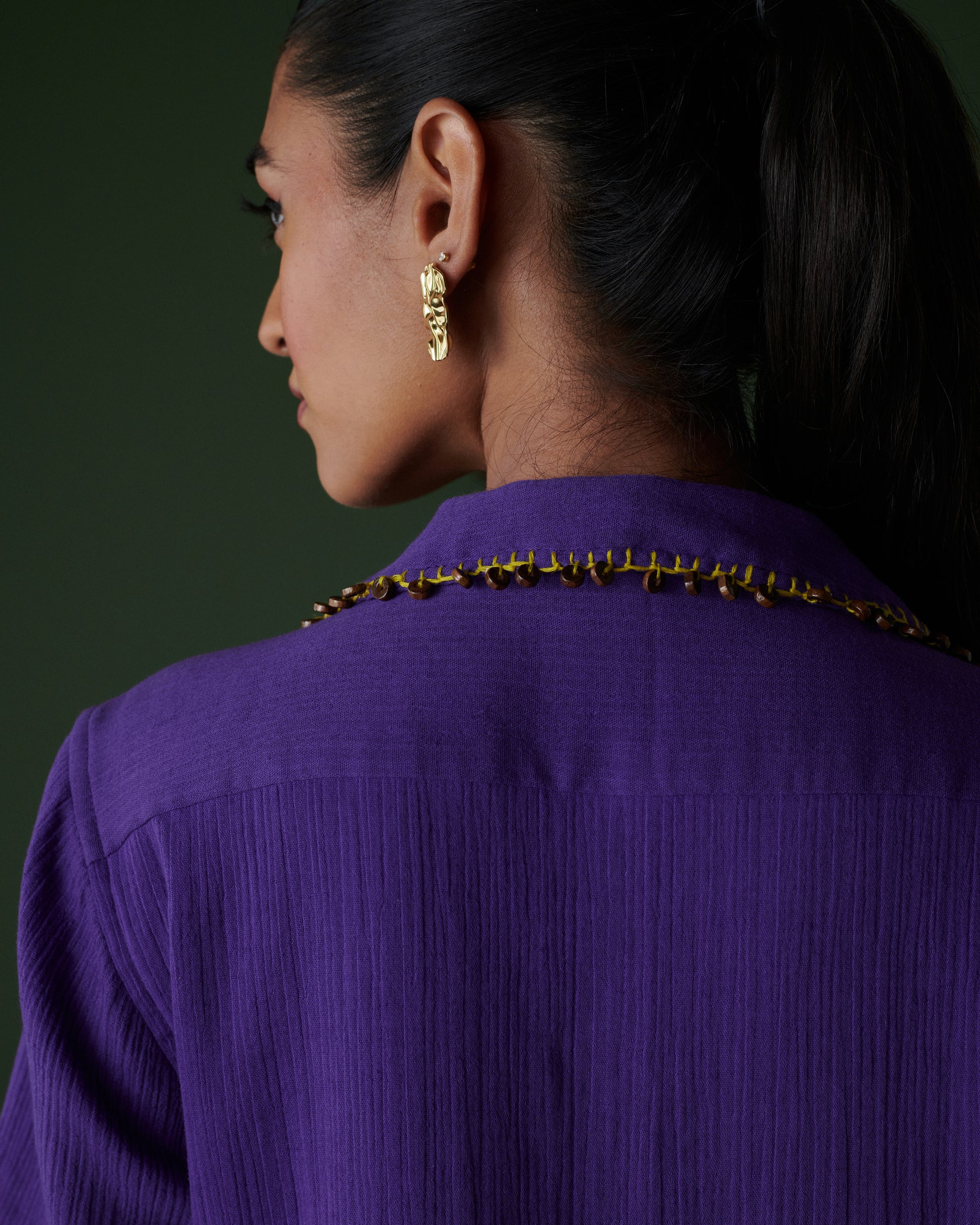 Back neckline detail of Kool Khatta Co-ord Set in purple cotton, featuring intricate bead embellishments and textured finish.
