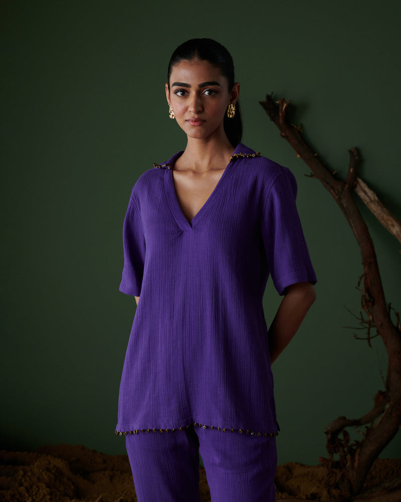 Close-up of Kool Khatta Co-ord Set in purple textured cotton, featuring V-neck top with bead detailing on collar & hem.
