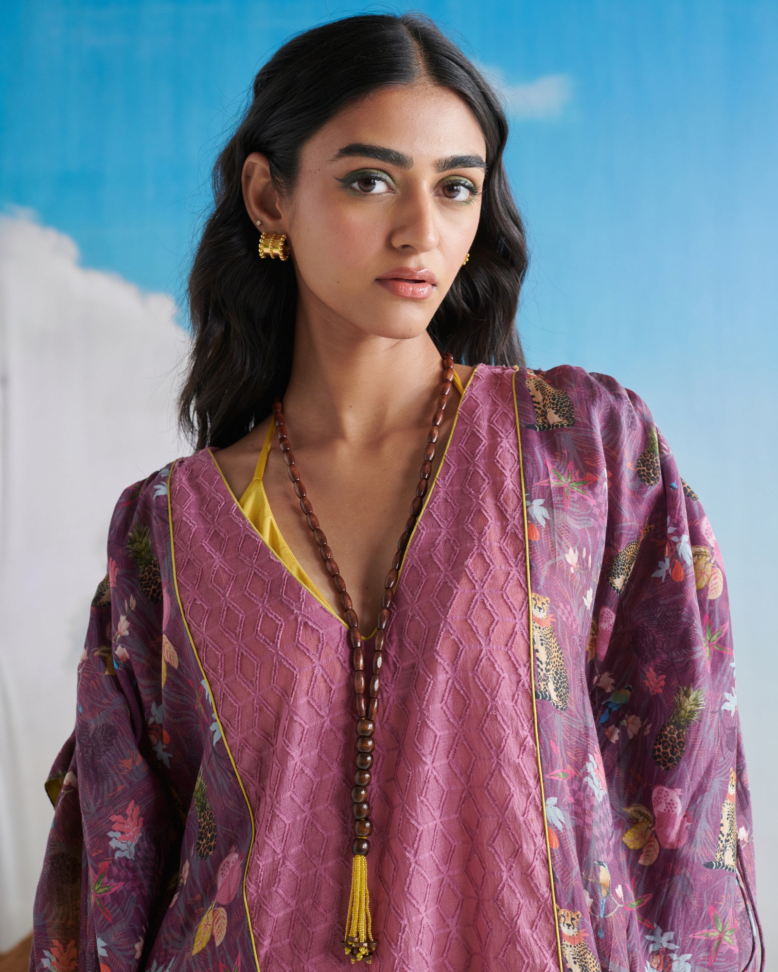 Elegant look of Naarangi Falsa Fantasy kaftaan in purple tones, modern flowy style.