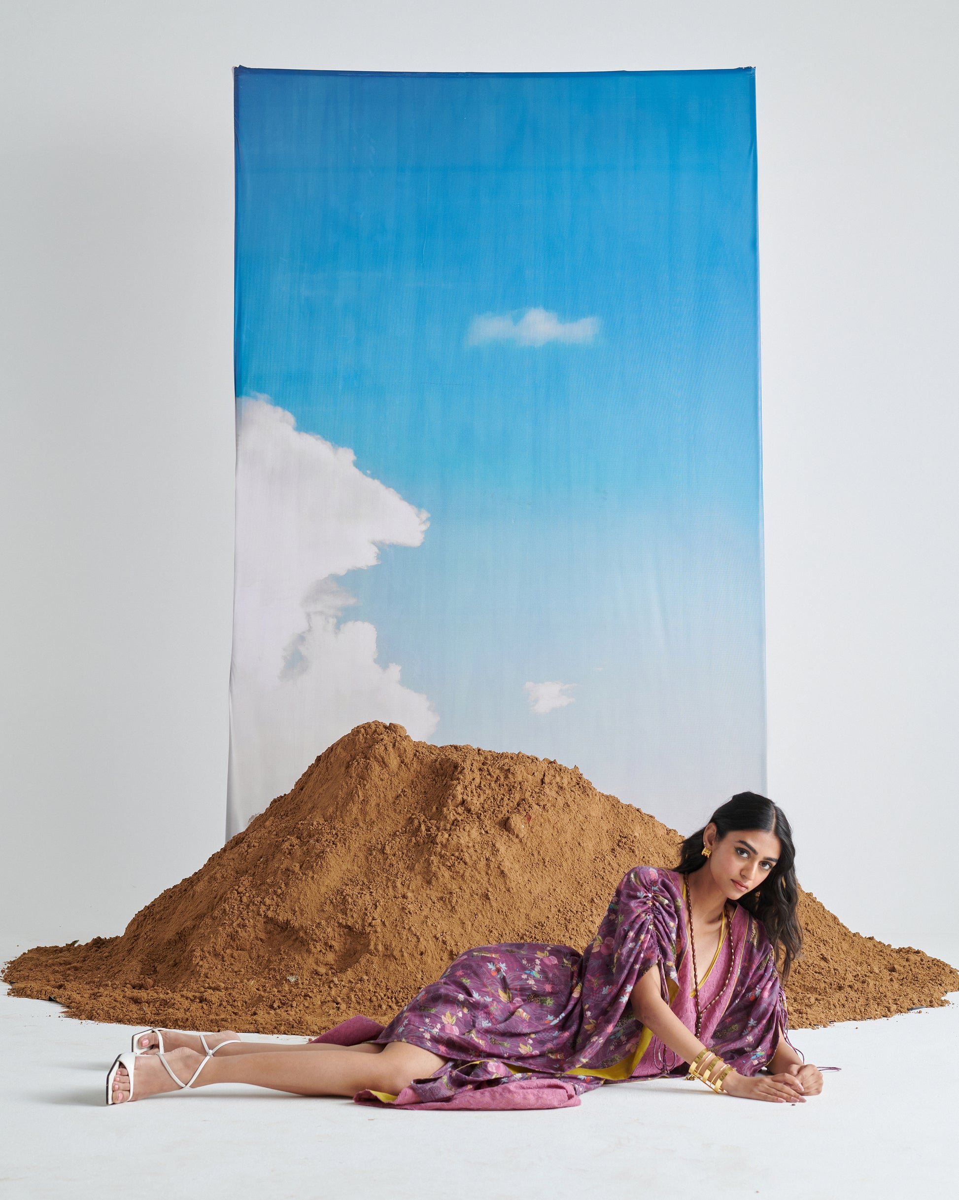 Fashion model styling Naarangi Falsa Fantasy kaftaan in purple, modern chic kaftaan outfit.