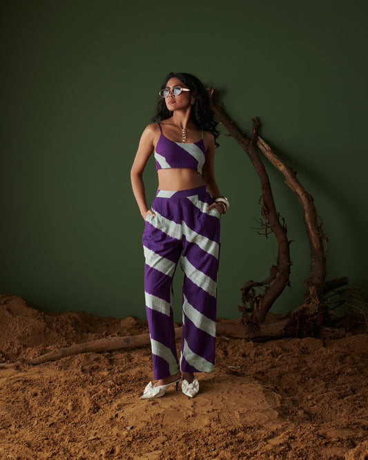 Naarangi Jamun Swirl Pants in purple with white swirl stripes, styled with matching crop top for a coordinated modern look.