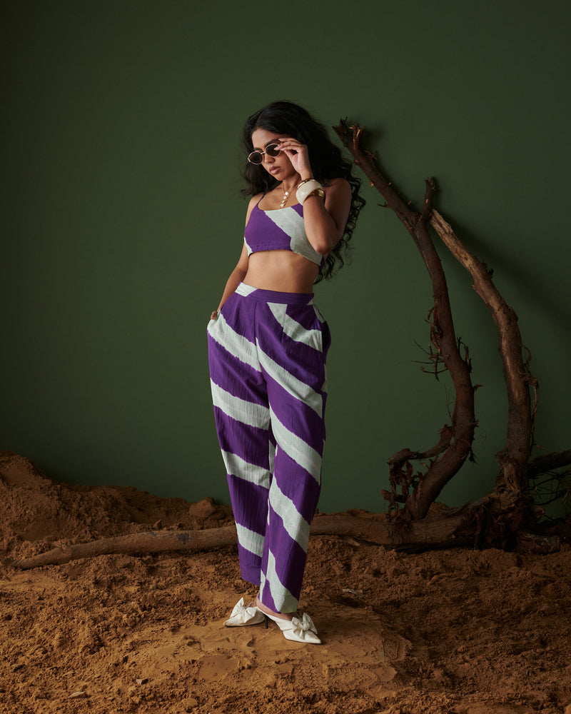 Naarangi Jamun Swirl Pants in purple with bold white swirl stripes, paired with crop top for a chic and stylish modern outfit.
