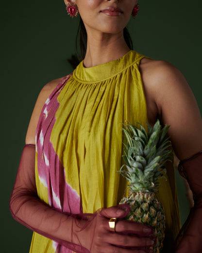 Close-up of Naarangi Nimbu Twist yellow dress with pink tie-dye and accessories.