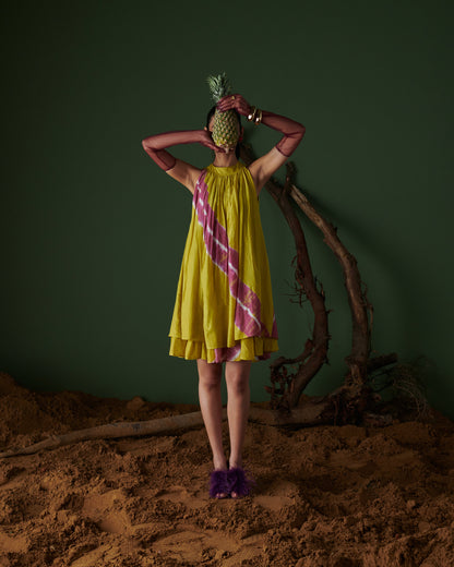 Full front view of model wearing Naarangi Nimbu Twist yellow dress with pink pattern.