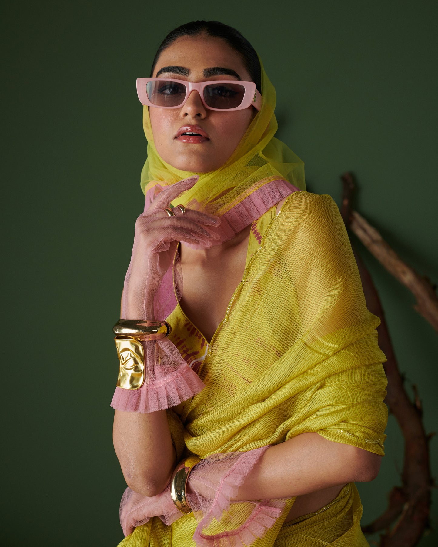 Model in Nimbu Soda Pop saree with blouse by Naarangi, lime yellow saree styled with magenta blouse and pink sunglasses, chic and modern ethnic fashion look.