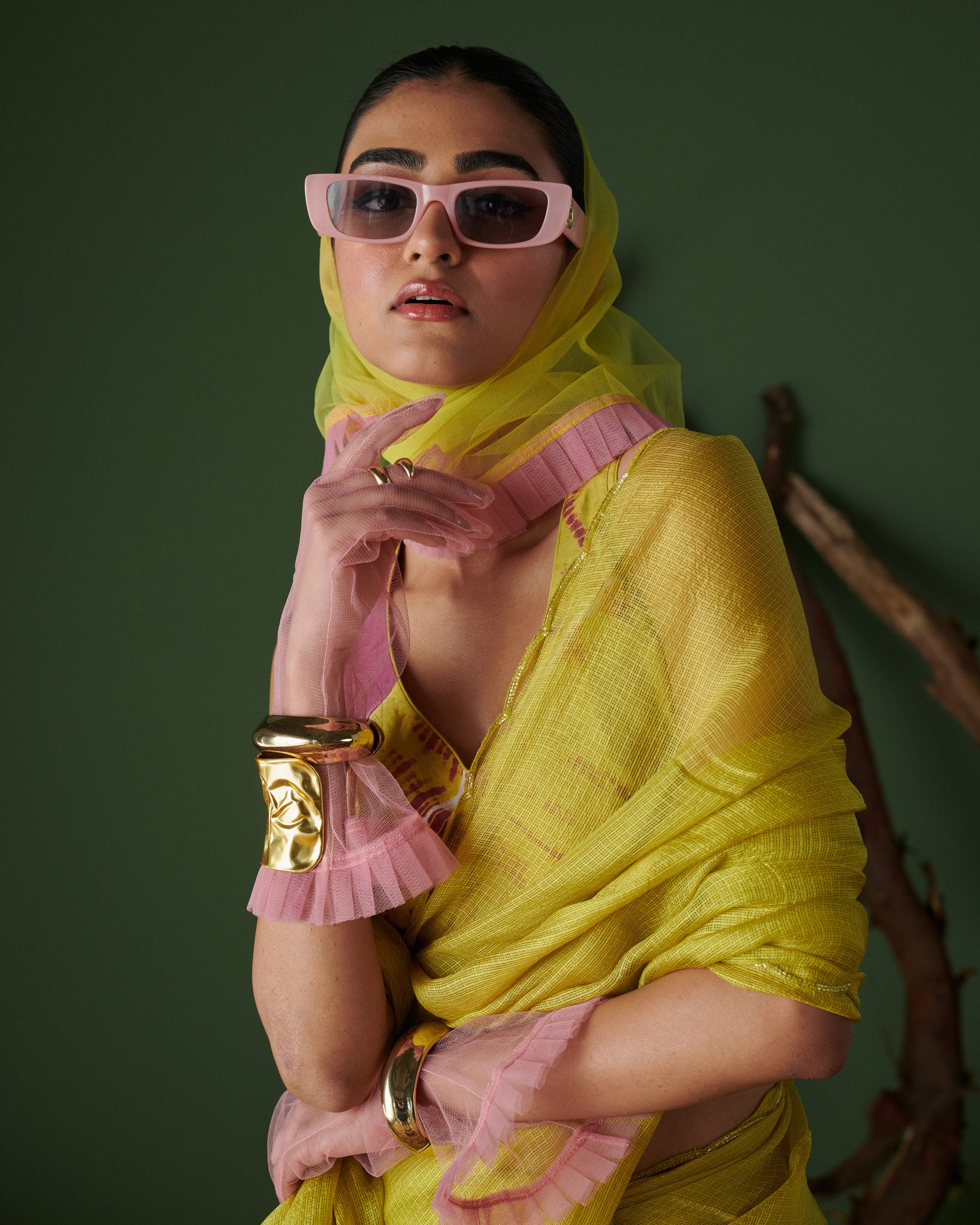 Model in Nimbu Soda Pop saree with blouse by Naarangi, lime yellow saree styled with magenta blouse and pink sunglasses, chic and modern ethnic fashion look.