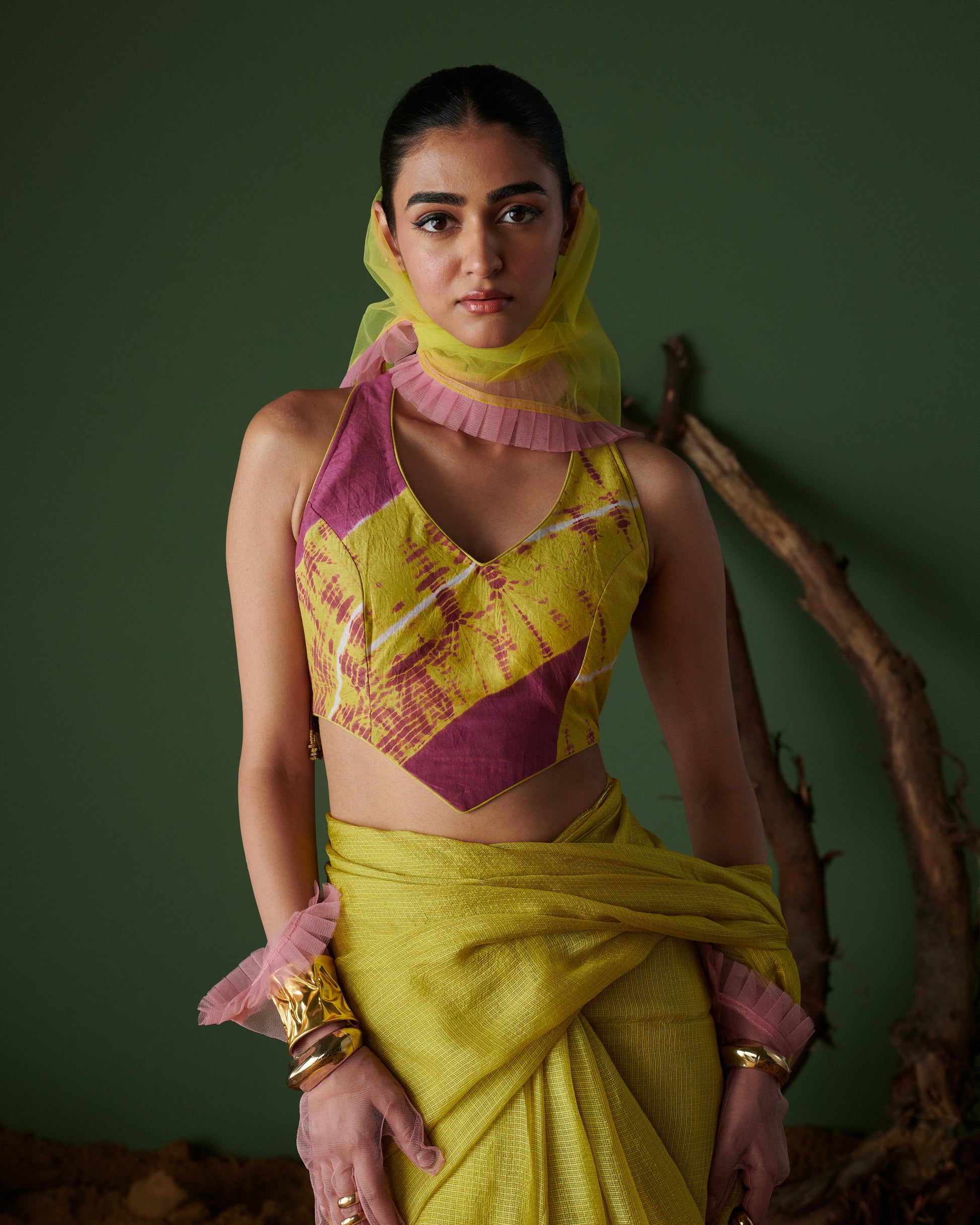 Front view of model wearing Nimbu Soda Pop saree with blouse by Naarangi, lime yellow and magenta handwoven fabric, styled with net dupatta and golden bangles, festive ethnic wear India.