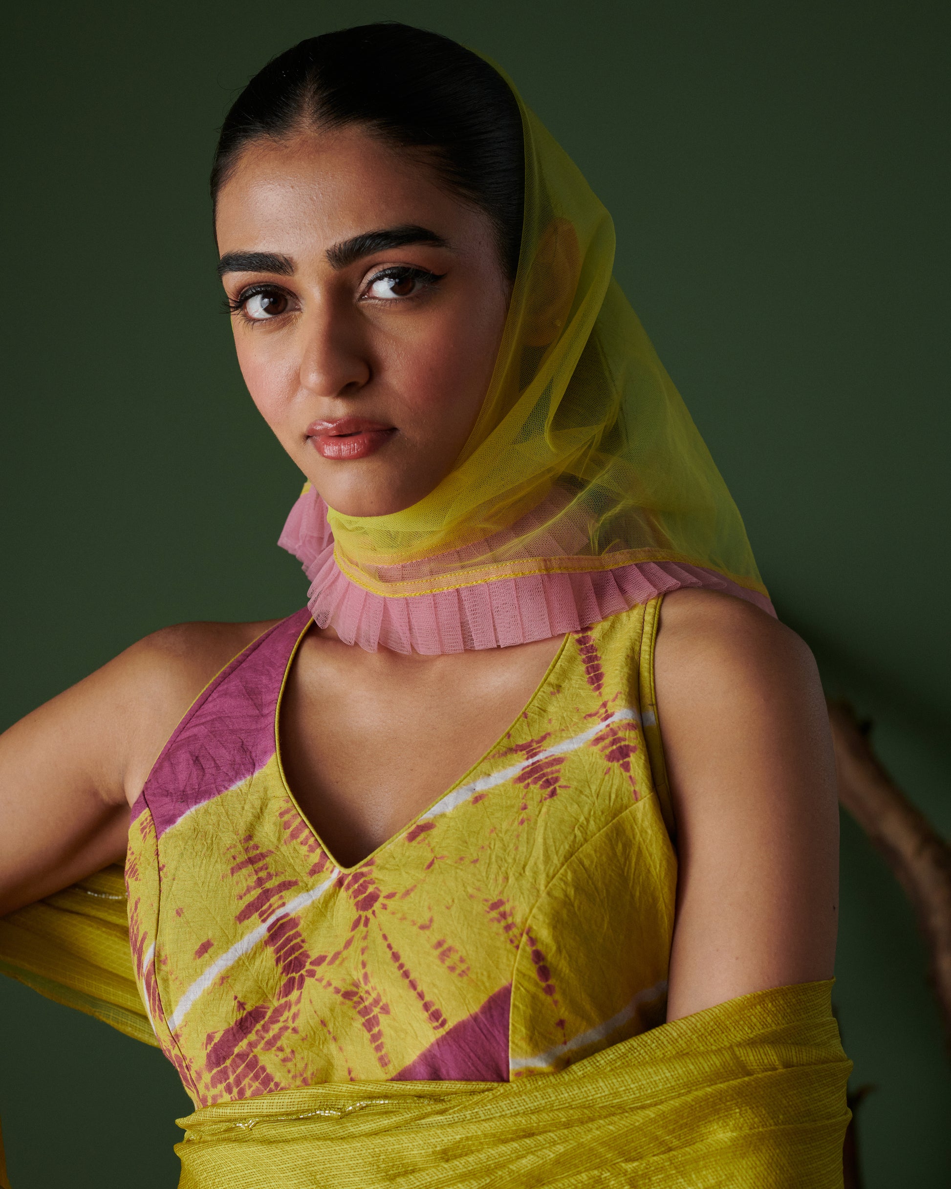 Close-up of model in Nimbu Soda Pop saree with blouse by Naarangi, showcasing lime yellow handwoven fabric with magenta accents and net dupatta, festive ethnic wear India.