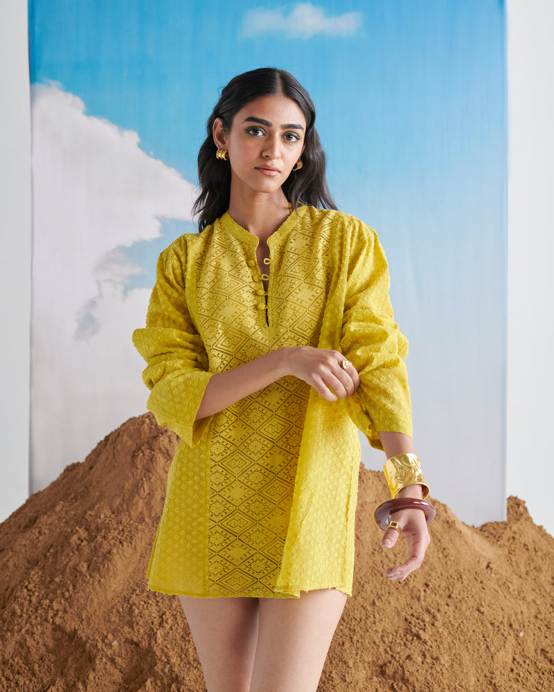 Front view of Tangy Tadka Kurta in bright yellow, featuring intricate textured design, long sleeves and elegant neckline.